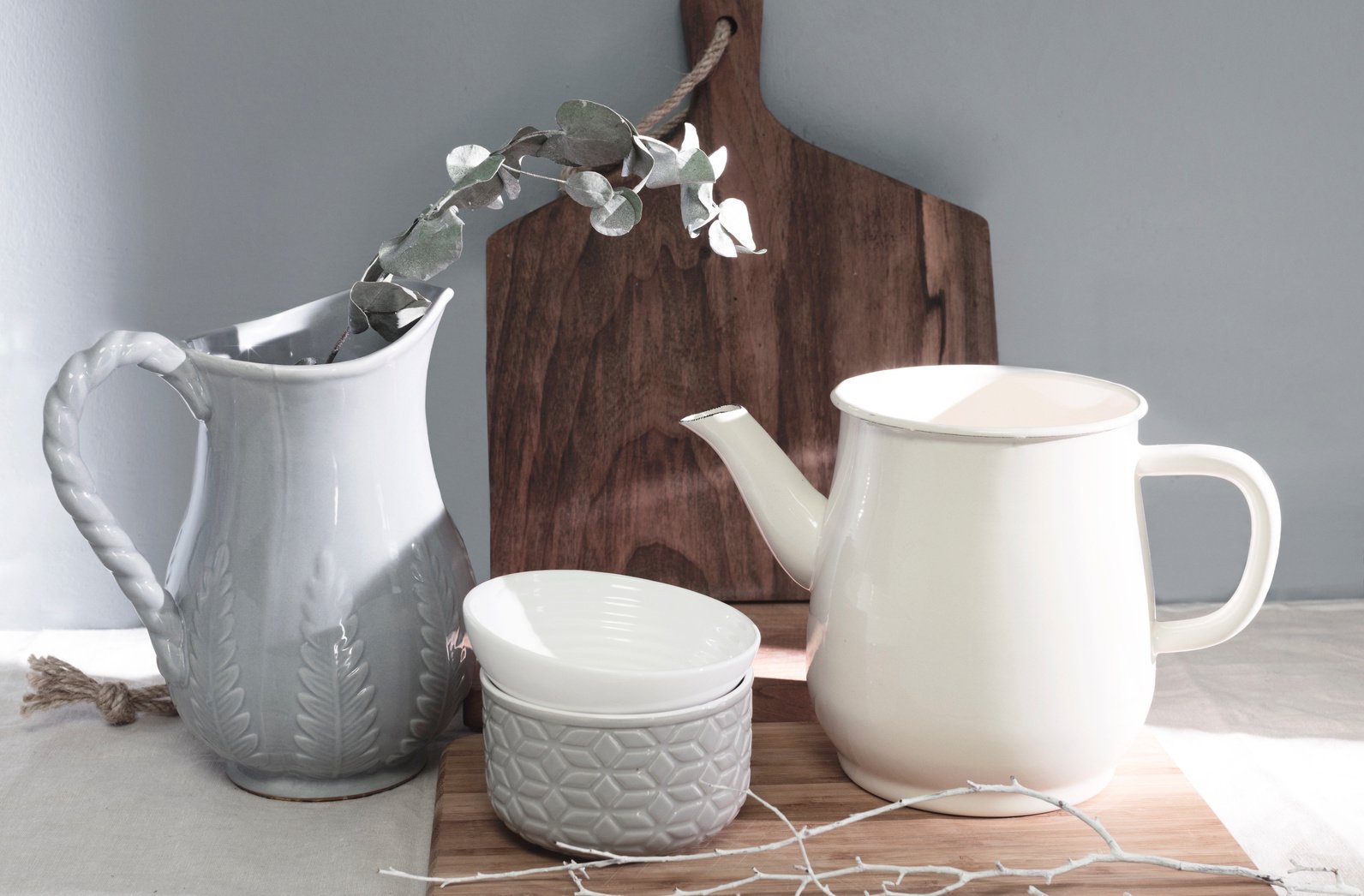 White Ceramic Pitcher Beside the Ceramic Bowls 